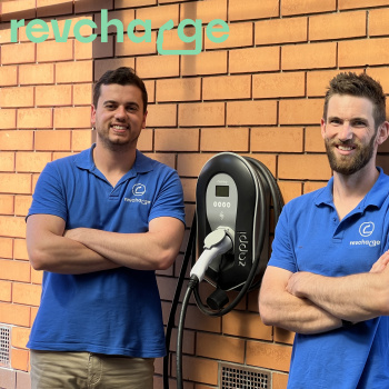 Revcharge crew standing next to revcharge station